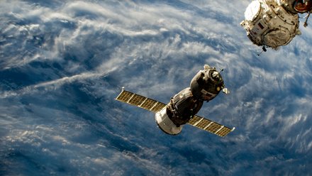 The Soyuz MS-23 crew ship approaches the space station after undocking and moving earlier from the Poisk module.