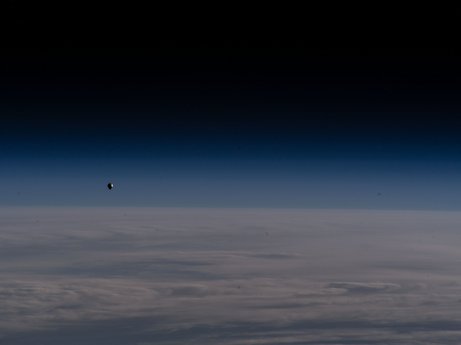 The SpaceX Freedom Dragon crew spacecraft with the Axiom Mission-2 crew aboard is pictured approaching the International Space Station.